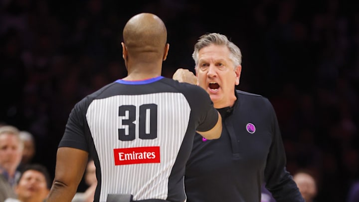 Dec 19, 2025; Minneapolis, Minnesota, USA; Minnesota Timberwolves head coach Chris Finch yells at referee John Butler about a call for the Oklahoma City Thunder in the first quarter at Target Center. Finch was ejected.