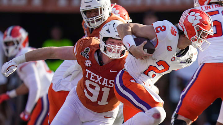 Texas Longhorns linebacker Ethan Burke (91)sacks Clemson Tigers quarterback Cade Klubnik (2) in the first half of an NCAA College Football Playoffs first round game at Darrell K Royal Texas Memorial Stadium, Austin, Texas, Saturday, Dec. 21, 2024. Texas Longhorns linebacker Ethan Burke (91)sacks Clemson Tigers quarterback Cade Klubnik (2) in the first half of an NCAA College Football Playoffs first round game at Darrell K Royal Texas Memorial Stadium, Austin, Texas, Saturday, Dec. 21, 2024.