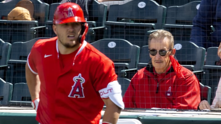 Mar 16, 2021; Tempe, Arizona, USA; Los Angeles Angels owner Arte Moreno (right) and outfielder Mike Trout against the Cleveland Indians during a Spring Training game at Tempe Diablo Stadium. Mandatory Credit: Mark J. Rebilas-Imagn Images