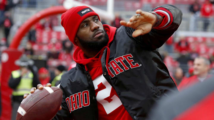 Nov 26, 2016; Columbus, OH, USA;  Cleveland Cavaliers player LeBron James plays catch with the Ohio State Buckeyes team before the game against the Michigan Wolverines at Ohio Stadium. Mandatory Credit: Joe Maiorana-Imagn Images