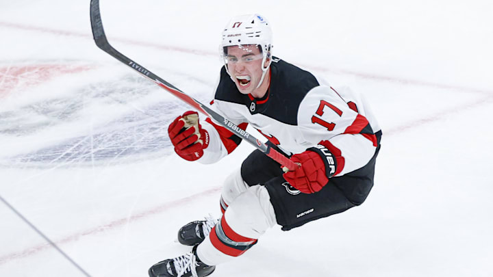 New Jersey Devils defenseman Simon Nemec (17) celebrates after scoring a game-winning goal against Chicago Blackhawks goaltender Spencer Knight during overtime at the United Center. Mandatory Credit: Kamil Krzaczynski-Imagn Images