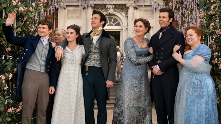 Bridgerton. (L to R) Will Tilston as Gregory Bridgerton, Florence Hunt as Hyacinth Bridgerton, Luke Thompson as Benedict Bridgerton, Ruth Gemmell as Lady Violet Bridgerton, Luke Newton as Colin Bridgerton, Nicola Coughlan as Penelope Featherington in episode 308 of Bridgerton. Cr. Liam Daniel/Netflix © 2024