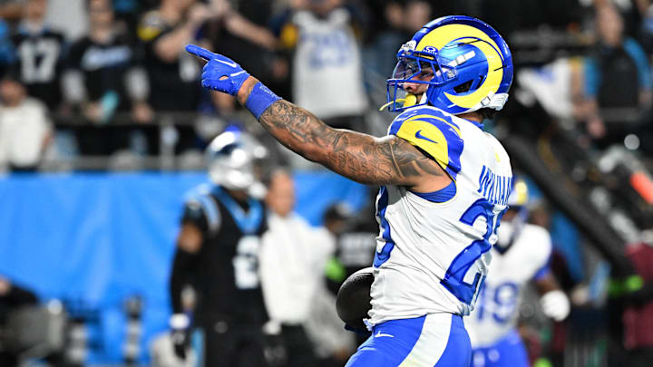 Jan 10, 2026; Charlotte, NC, USA; Los Angeles Rams running back Kyren Williams (23) reacts after rushing for a touchdown against the Carolina Panthers in the second half during the NFC Wild Card Round game at Bank of America Stadium. 