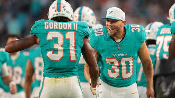 Miami Dolphins fullback Alec Ingold (30) celebrates with running back Ollie Gordon II (31) against the Jacksonville Jaguars during the second quarter at Hard Rock Stadium during the 2025 preseason.