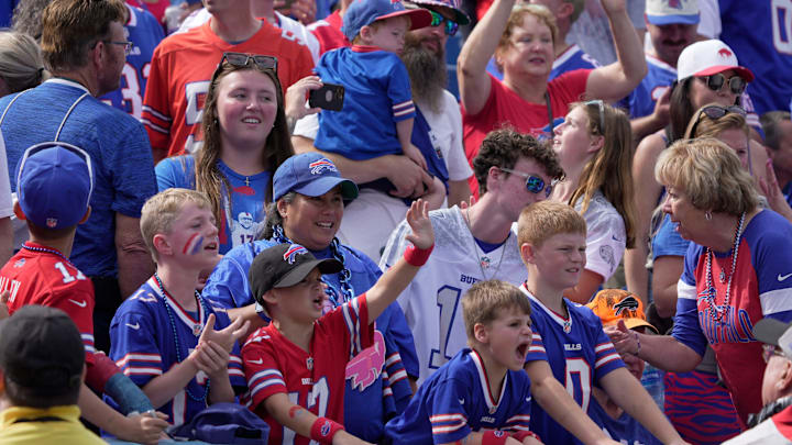Young fans call out to Buffalo Bills running back Ty Johnson to play catch with them during team warm ups before he Bills home game against the New Orleans Saints in Orchard Park on Sept. 28, 2025. Young fans call out to Buffalo Bills running back Ty Johnson to play catch with them during team warm ups before he Bills home game against the New Orleans Saints in Orchard Park on Sept. 28, 2025.