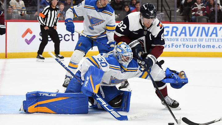 Oct 3, 2026; Denver, Colorado, USA; Colorado Avalanche left winger Gabriel Landeskog (92) works against St. Louis Blues goalie Jordan Binnington (50) for a loose puck during the second period at Ball Arena. Mandatory Credit: Christopher Hanewinckel-Imagn Images