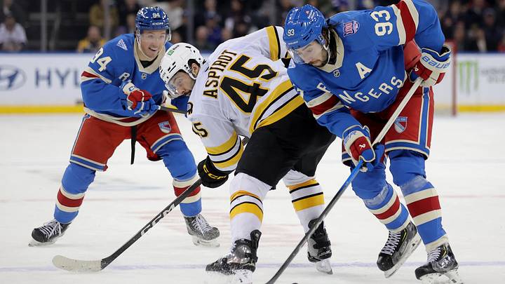 Jan 26, 2026; New York, New York, USA; Boston Bruins defenseman Jonathan Aspirot (45) fights for the puck against New York Rangers center Mika Zibanejad (93) and right wing Gabe Perreault (94) during the second period at Madison Square Garden. Mandatory Credit: Brad Penner-Imagn Images Jan 26, 2026; New York, New York, USA; Boston Bruins defenseman Jonathan Aspirot (45) fights for the puck against New York Rangers center Mika Zibanejad (93) and right wing Gabe Perreault (94) during the second period at Madison Square Garden. Mandatory Credit: Brad Penner-Imagn Images