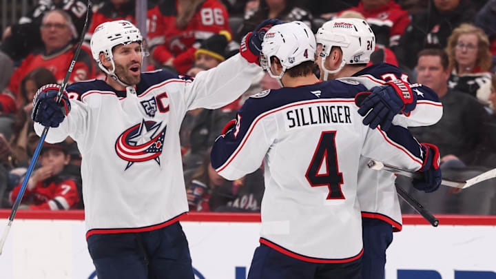 Boone Jenner and Cole Sillinger celebrate Mathieu Olivier's goal against the New Jersey Devils