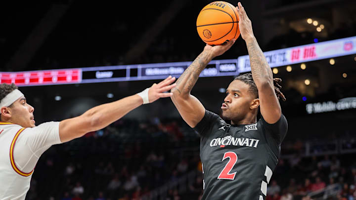 Mar 12, 2025; Kansas City, MO, USA; Cincinnati Bearcats guard Jizzle James (2) shoots the ball during the second half against the Iowa State Cyclones at T-Mobile Center. Mandatory Credit: William Purnell-Imagn Images Mar 12, 2025; Kansas City, MO, USA; Cincinnati Bearcats guard Jizzle James (2) shoots the ball during the second half against the Iowa State Cyclones at T-Mobile Center. Mandatory Credit: William Purnell-Imagn Images