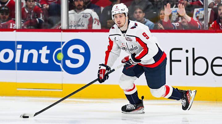 Apr 27, 2025; Montreal, Quebec, CAN; Washington Capitals right wing Ryan Leonard (9) plays the puck against the Montreal Canadiens during the second period in game four of the first round of the 2025 Stanley Cup Playoffs at Bell Centre. Mandatory Credit: David Kirouac-Imagn Images