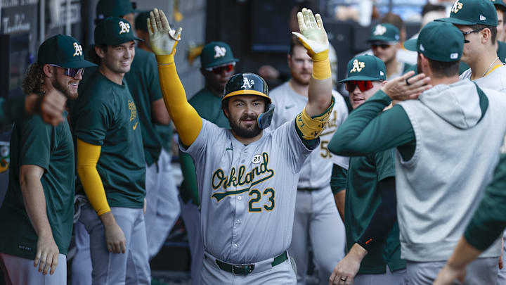 Sep 15, 2024; Chicago, Illinois, USA; Oakland Athletics catcher Shea Langeliers (23) celebrates with teammates after hitting a solo home run against the Chicago White Sox during the ninth inning at Guaranteed Rate Field. Mandatory Credit: Kamil Krzaczynski-Imagn Images Sep 15, 2024; Chicago, Illinois, USA; Oakland Athletics catcher Shea Langeliers (23) celebrates with teammates after hitting a solo home run against the Chicago White Sox during the ninth inning at Guaranteed Rate Field. Mandatory Credit: Kamil Krzaczynski-Imagn Images