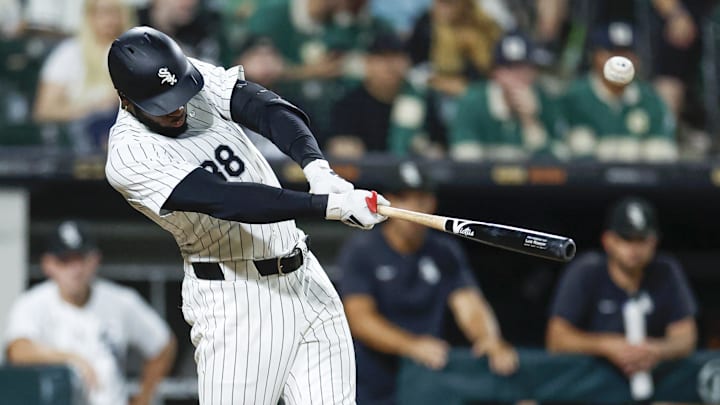 Sep 14, 2024; Chicago, Illinois, USA; Chicago White Sox outfielder Luis Robert Jr. (88) singles against the Oakland Athletics during the seventh inning at Guaranteed Rate Field.