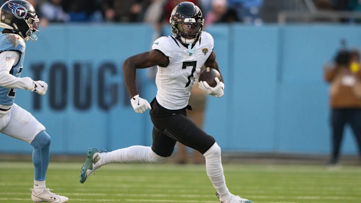 Nov 30, 2025; Nashville, Tennessee, USA;  Jacksonville Jaguars wide receiver Brian Thomas Jr. (7) runs with the ball after a made catch against the Tennessee Titans