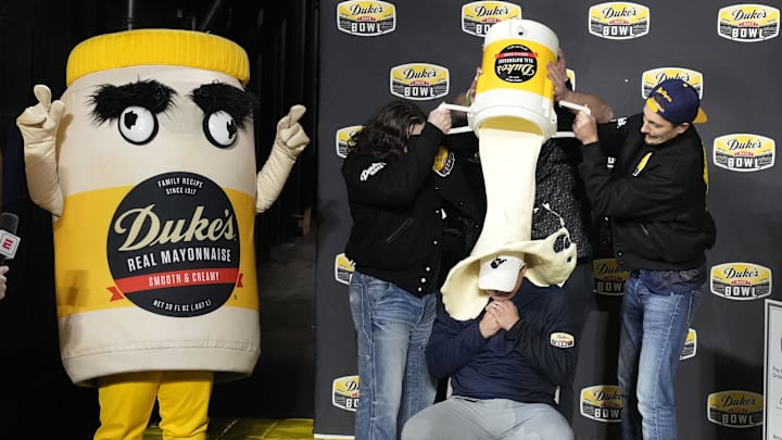 Dec 27, 2023; Charlotte, NC, USA; West Virginia Mountaineers head coach Neal Brown gets covered in mayonnaise after the game at Bank of America Stadium. Mandatory Credit: Bob Donnan-Imagn Images Dec 27, 2023; Charlotte, NC, USA; West Virginia Mountaineers head coach Neal Brown gets covered in mayonnaise after the game at Bank of America Stadium. Mandatory Credit: Bob Donnan-Imagn Images