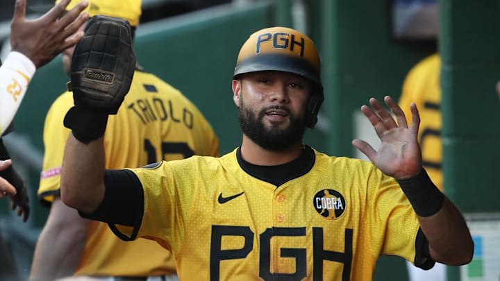 Aug 22, 2025; Pittsburgh, Pennsylvania, USA; Pittsburgh Pirates third baseman Isiah Kiner-Falefa (7) celebrates in the dugout after scoring a run against the Colorado Rockies during the second inning at PNC Park. Mandatory Credit: Charles LeClaire-Imagn Images