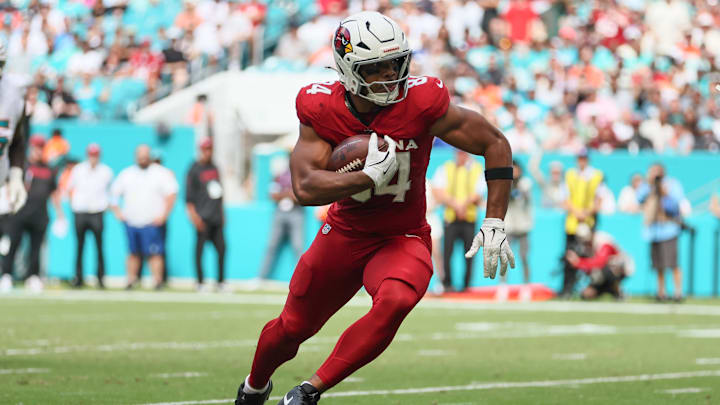Oct 27, 2024; Miami Gardens, Florida, USA; Arizona Cardinals tight end Elijah Higgins (84) runs with the football against the Miami Dolphins during the second quarter at Hard Rock Stadium. Mandatory Credit: Sam Navarro-Imagn Images Oct 27, 2024; Miami Gardens, Florida, USA; Arizona Cardinals tight end Elijah Higgins (84) runs with the football against the Miami Dolphins during the second quarter at Hard Rock Stadium. Mandatory Credit: Sam Navarro-Imagn Images