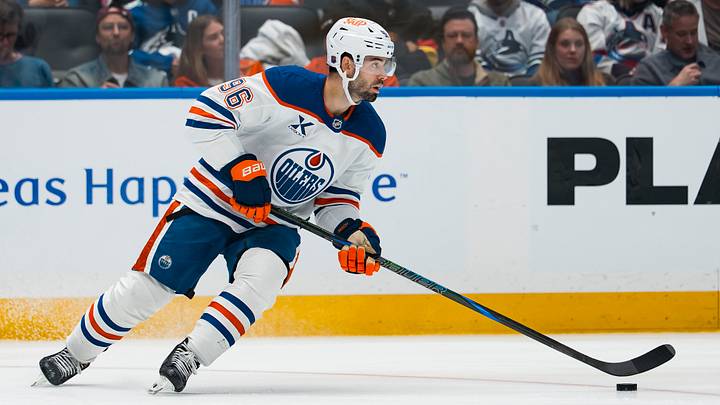 Oct 1, 2026; Vancouver, British Columbia, CAN; Edmonton Oilers defenseman Jake Walman (96) handles the puck against the Vancouver Canucks in the second period at Rogers Arena. Mandatory Credit: Bob Frid-Imagn Images