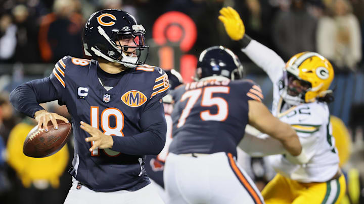 Dec 20, 2025; Chicago, Illinois, USA; Chicago Bears quarterback Caleb Williams (18) prepares to throw a pass and offensive tackle Ozzy Trapilo (75) blocks against Green Bay Packers defensive end Rashan Gary (52) during the first quarter at Soldier Field. Mandatory Credit: Mike Dinovo-Imagn Images Dec 20, 2025; Chicago, Illinois, USA; Chicago Bears quarterback Caleb Williams (18) prepares to throw a pass and offensive tackle Ozzy Trapilo (75) blocks against Green Bay Packers defensive end Rashan Gary (52) during the first quarter at Soldier Field. Mandatory Credit: Mike Dinovo-Imagn Images