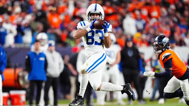 Dec 15, 2024; Denver, Colorado, USA; Indianapolis Colts tight end Kylen Granson (83) pulls in a reception in the fourth quarter against the Denver Broncos at Empower Field at Mile High. 