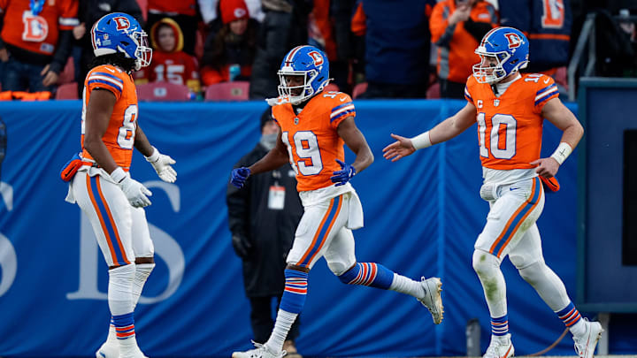 Jan 5, 2025; Denver, Colorado, USA; Denver Broncos wide receiver Marvin Mims Jr. (19) celebrates his touchdown with wide receiver Lil'Jordan Humphrey (84) and quarterback Bo Nix (10) in the third quarter against the Kansas City Chiefs at Empower Field at Mile High. Mandatory Credit: Isaiah J. Downing-Imagn Images