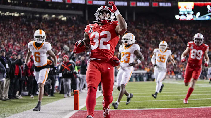 Ohio State Buckeyes running back TreVeyon Henderson (32) runs for a touchdown during the first half of the College Football Playoff first round game against the Tennessee Volunteers at Ohio Stadium in Columbus on Dec. 21, 2024.