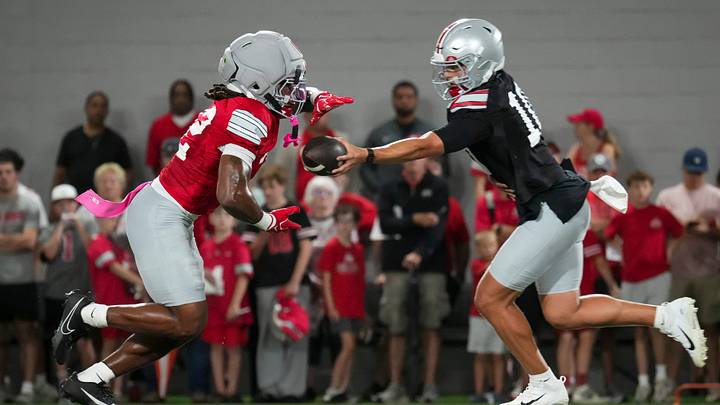 Ohio State Buckeyes quarterback Julian Sayin (10) hands off to running back Isaiah West (32) during football training camp inside the Woody Hayes Athletic Center in Columbus on Aug. 7, 2026.