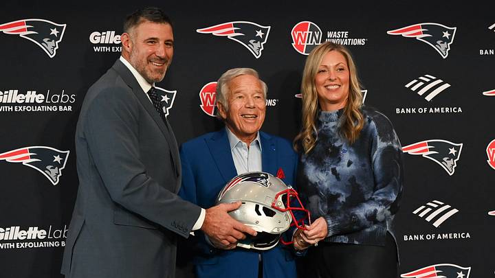 Jan 13, 2025; Foxborough, MA, USA; Mike Vrabel (l) and his wife Jennifer (r) pose for a photo with New England Patriots owner Robert Kraft (c) after a press conference at Gillette Stadium to introduce Vrabel as the Patriots head coach. Jan 13, 2025; Foxborough, MA, USA; Mike Vrabel (l) and his wife Jennifer (r) pose for a photo with New England Patriots owner Robert Kraft (c) after a press conference at Gillette Stadium to introduce Vrabel as the Patriots head coach.