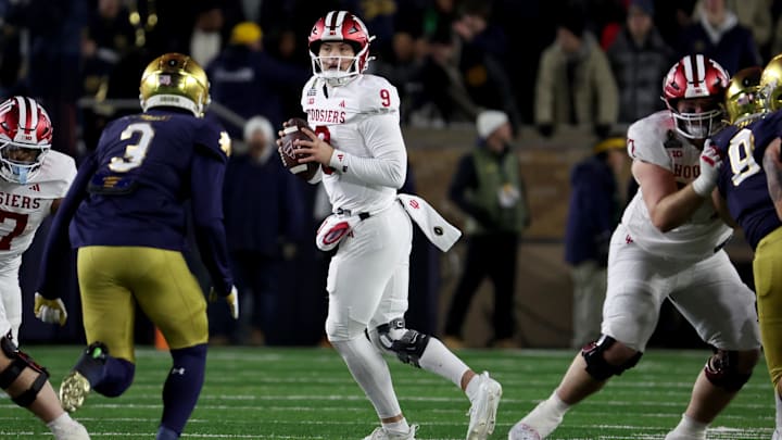 Dec 20, 2024; Notre Dame, Indiana, USA; Indiana Hoosiers quarterback Kurtis Rourke (9) drops to throw during the first half against the Notre Dame Fighting Irish at Notre Dame Stadium. Mandatory Credit: Trevor Ruszkowski-Imagn Images