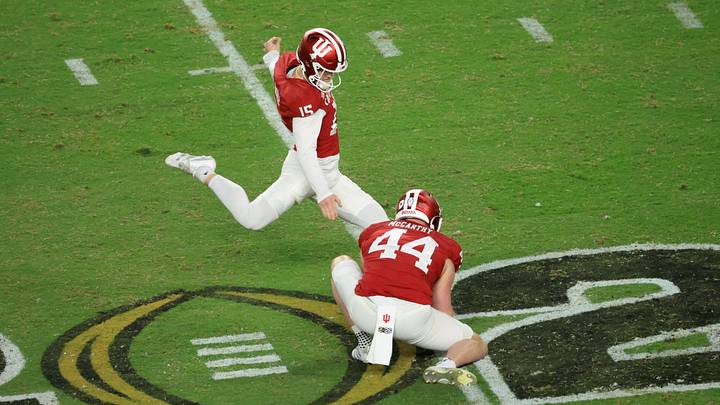 Jan 19, 2026; Miami Gardens, FL, USA; Indiana Hoosiers place kicker Nico Radicic (15) kicks a field goal against the Miami Hurricanes in the fourth quarter during the College Football Playoff National Championship game at Hard Rock Stadium. Mandatory Credit: Kim Klement Neitzel-Imagn Images Jan 19, 2026; Miami Gardens, FL, USA; Indiana Hoosiers place kicker Nico Radicic (15) kicks a field goal against the Miami Hurricanes in the fourth quarter during the College Football Playoff National Championship game at Hard Rock Stadium. Mandatory Credit: Kim Klement Neitzel-Imagn Images