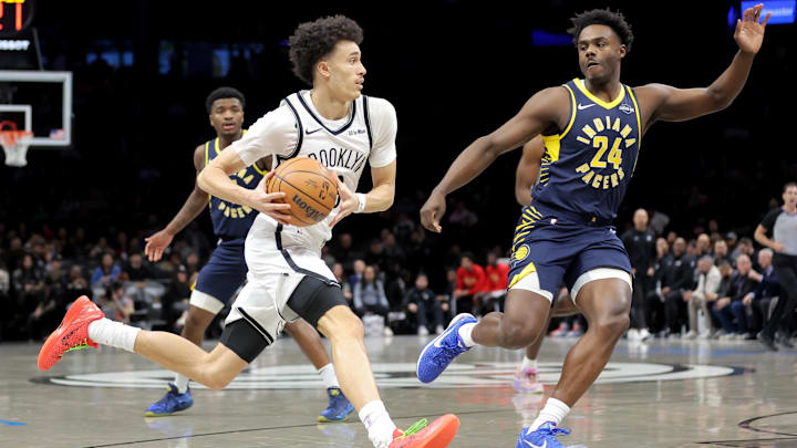 Feb 11, 2026; Brooklyn, New York, USA; Brooklyn Nets guard Nolan Traore (88) drives to the basket against Indiana Pacers guard Kobe Brown (24) during the first quarter at Barclays Center.