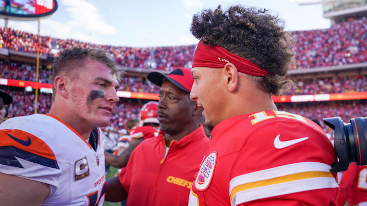 Nov 10, 2024; Kansas City, Missouri, USA; Kansas City Chiefs quarterback Patrick Mahomes (15) greets Denver Broncos quarterback Bo Nix (10) after the game at GEHA Field at Arrowhead Stadium. Mandatory Credit: Denny Medley-Imagn Images