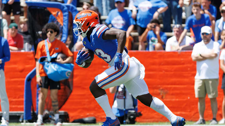 Apr 12, 2025; Gainesville, FL, USA; Florida Gators running back Jadan Baugh (13) rushes with the ball during the first half at Ben Hill Griffin Stadium. Mandatory Credit: Matt Pendleton-Imagn Images