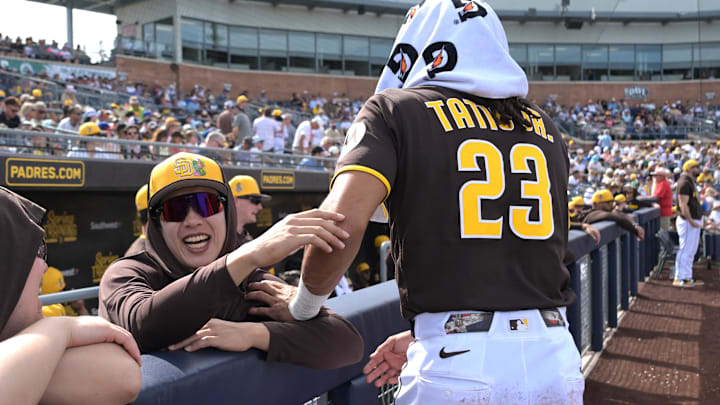 Feb 23, 2026; Peoria, Arizona, USA;  San Diego Padres third baseman Sung-Mun Song (24) and San Diego Padres right fielder Fernando Tatis Jr. (23) share a laugh in the dugout during the game against the Milwaukee Brewers at Peoria Sports Complex. Mandatory Credit: Jayne Kamin-Oncea-Imagn Images