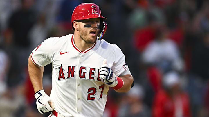 Apr 19, 2025; Anaheim, California, USA; Los Angeles Angels designated hitter Mike Trout (27) hits a one run home run against the San Francisco Giants during the fourth inning at Angel Stadium. Mandatory Credit: Jonathan Hui-Imagn Images