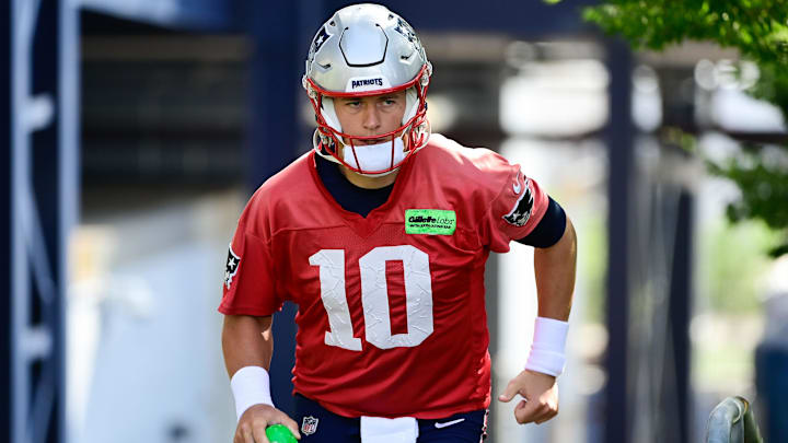 Jul 26, 2023; Foxborough, MA, USA; New England Patriots quarterback Mac Jones (10) makes his way to