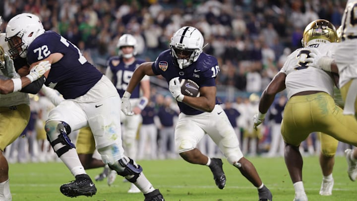 Penn State Nittany Lions running back Nicholas Singleton (10) runs the ball vs. the Notre Dame Fighting Irish  in the Orange Bowl at Hard Rock Stadium. 