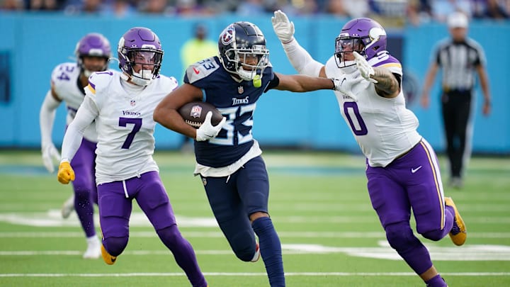 Tennessee Titans wide receiver Tyler Boyd (83) tries to evade Minnesota Vikings linebacker Ivan Pace Jr. (0) during the fourth quarter at Nissan Stadium in Nashville, Tenn., Sunday, Nov. 17, 2024. Tennessee Titans wide receiver Tyler Boyd (83) tries to evade Minnesota Vikings linebacker Ivan Pace Jr. (0) during the fourth quarter at Nissan Stadium in Nashville, Tenn., Sunday, Nov. 17, 2024.