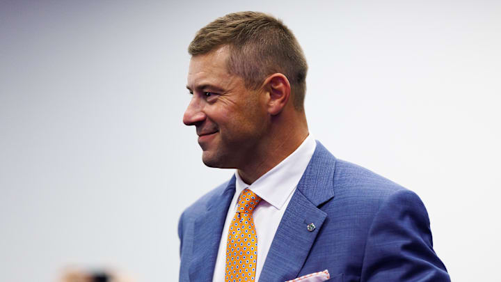 Dec 1, 2025; Gainesville, FL, USA; Florida Gators head coach Jon Sumrall walks into the room before the press conference at the Heavener Football Training Center at the University of Florida. Mandatory Credit: Matt Pendleton-Imagn Images