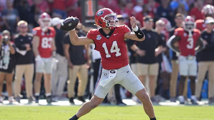 Oct 18, 2025; Athens, Georgia, USA; Georgia Bulldogs quarterback Gunner Stockton (14) passes against the Mississippi Rebels during the first quarter of the game at Sanford Stadium. Mandatory Credit: Dale Zanine-Imagn Images