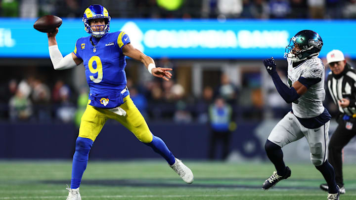 Dec 18, 2025; Seattle, Washington, USA; Los Angeles Rams quarterback Matthew Stafford (9) passes against the Seattle Seahawks in the first half at Lumen Field. Mandatory Credit: Kevin Ng-Imagn Images