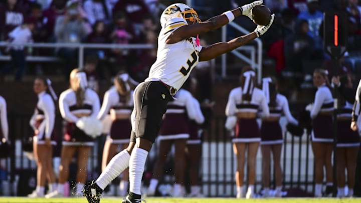 Nov 23, 2024; Starkville, Mississippi, USA; Missouri Tigers wide receiver Luther Burden III (3) attempts to make a reception against the Mississippi State Bulldogs during the first quarter at Davis Wade Stadium at Scott Field. Mandatory Credit: Matt Bush-Imagn Images