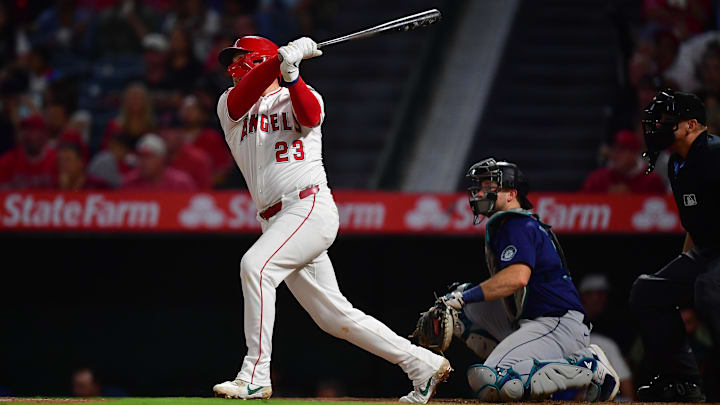 Aug 30, 2024; Anaheim, California, USA; Los Angeles Angels second baseman Brandon Drury (23) hits a solo home run against the Seattle Mariners during the fifth inning at Angel Stadium. Mandatory Credit: Gary A. Vasquez-Imagn Images