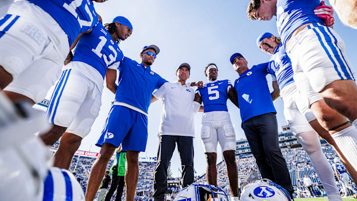 BYU wide receivers with coach Fesi Sitake ahead of home game against Arizona