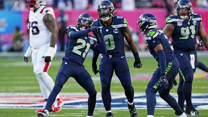 Seattle Seahawks defensive end DeMarcus Lawrence and cornerback Devon Witherspoon during Super Bowl LX.