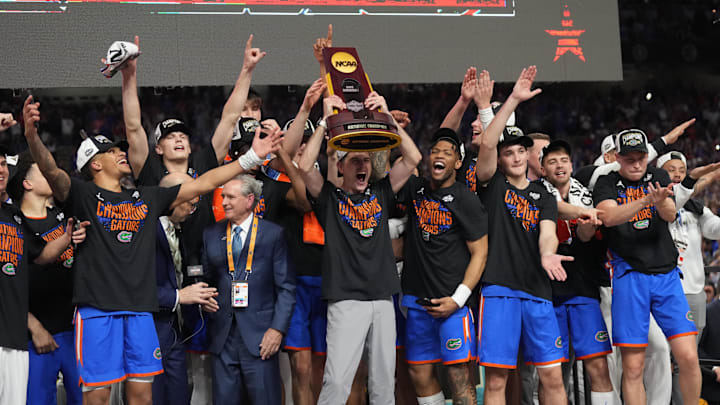Florida Gators players hoist the trophy after defeating the Houston Cougars in the national championship game of the 2025 NCAA Tournament at the Alamodome. 