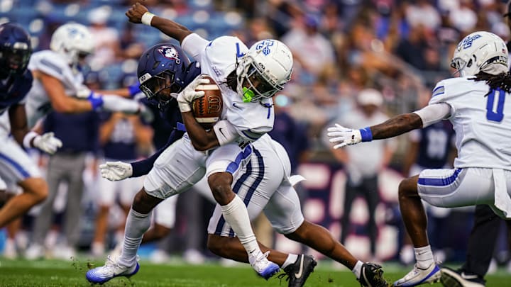 Central Connecticut State Blue Devils running back Elijah Howard (7) runs the ball against the UConn Huskies