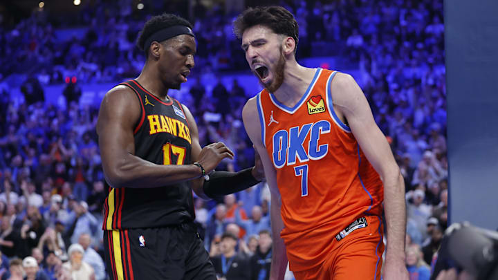 Dec 29, 2025; Oklahoma City, Oklahoma, USA; Oklahoma City Thunder center Chet Holmgren (7) screams next to Atlanta Hawks forward Onyeka Okongwu (17) after dunking against the Atlanta Hawks during the second half at Paycom Center. Mandatory Credit: Alonzo Adams-Imagn Images
