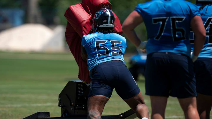 Tackle JC Latham (55) takes on the sled during Tennessee Titans practice at Ascension Saint Thomas Sports Park in Nashville, Tenn., Tuesday, May 21, 2024.