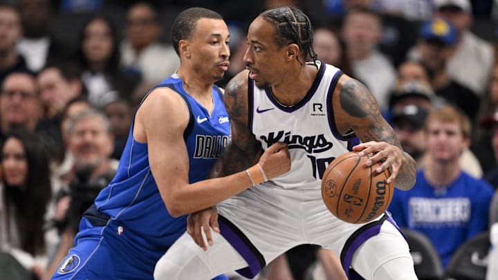 Feb 10, 2025; Dallas, Texas, USA; Sacramento Kings forward DeMar DeRozan (10) looks to move to the basket past Dallas Mavericks guard Dante Exum (0) during the first quarter at the American Airlines Center. Mandatory Credit: Jerome Miron-Imagn Images