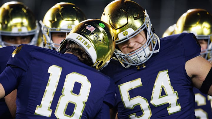 Notre Dame quarterback Steve Angeli (18) knocks helmets with offensive lineman Anthonie Knapp (54) before a NCAA college football game against Florida State at Notre Dame Stadium on Saturday, Nov. 9, 2024, in South Bend.